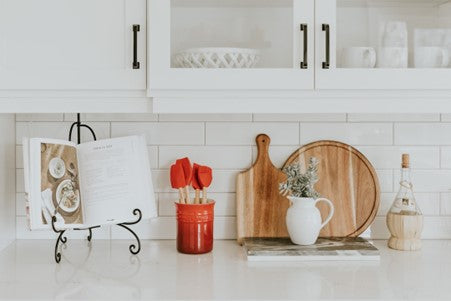 A kitchen Shelve having a nut milk jar on it